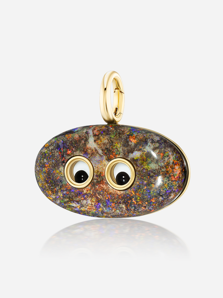Slightly angled close-up of Lil’ Buddies Pendant Johnny, multicolored 36ct opal in 18k yellow gold with crystal and onyx googly-eyes.