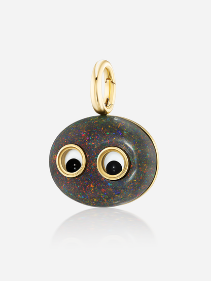 Angled close-up of Lil’ Buddies Pendant Stevie, 16.7ct dark opal in 18k yellow gold with crystal and onyx googly-eye details.